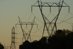 Photograph of electricity pylons against skyline